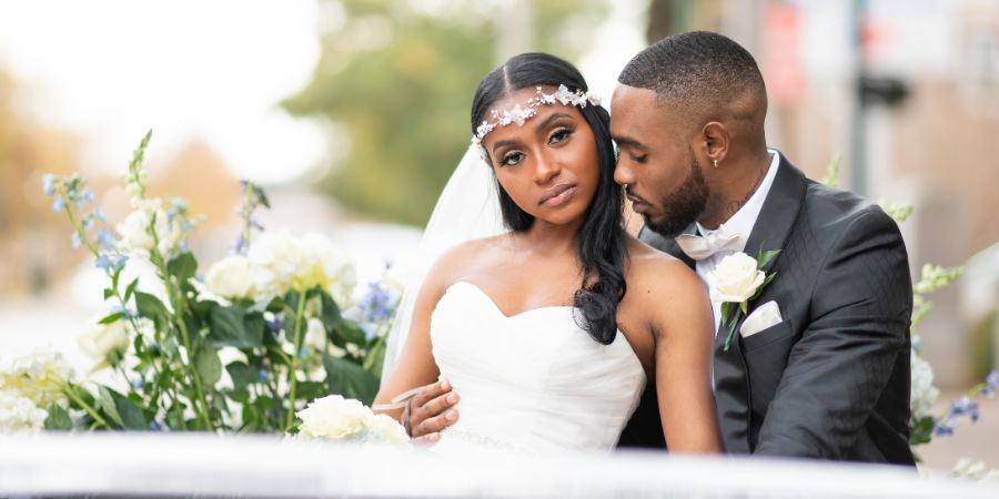 Bride and groom embracing on their wedding day, an example of how to get clients for an event planning business through creating memorable celebrations. Planned by Tyler Reid of Eminent Events. Photography by Forever Photography by Danielle Hollins.