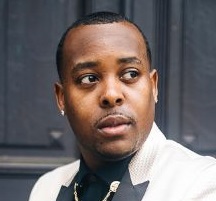 Event planner vs event coordinator – QC Event School graduate Tyler Reid dressed in formal attire.