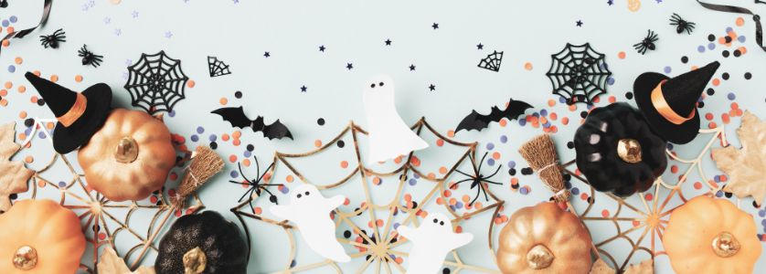 Halloween party ideas with decorated pumpkins, witch hats, ghosts, spiderwebs, and confetti—perfect inspiration for DIY Halloween food party ideas, Halloween games, and festive decor for adults or kids.