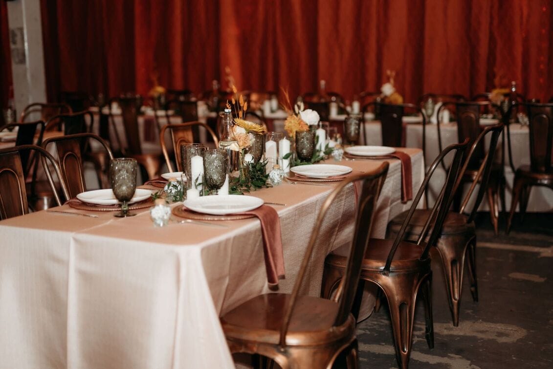 Elegant indoor dining setup with white linens for Minnesota wedding reception