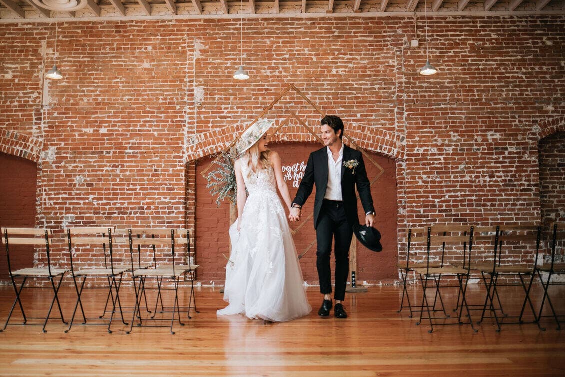 Couple walks down aisle at industrial Minneapolis wedding venue ceremony