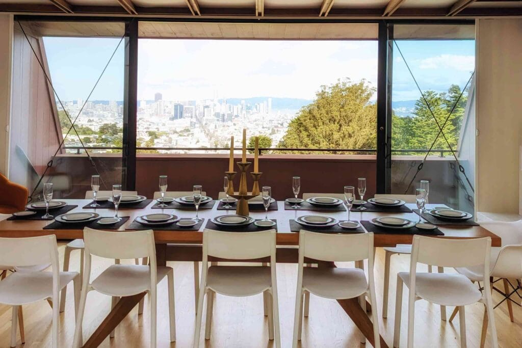 Intimate garden wedding ceremony on wooden platform with candlelight in Portland