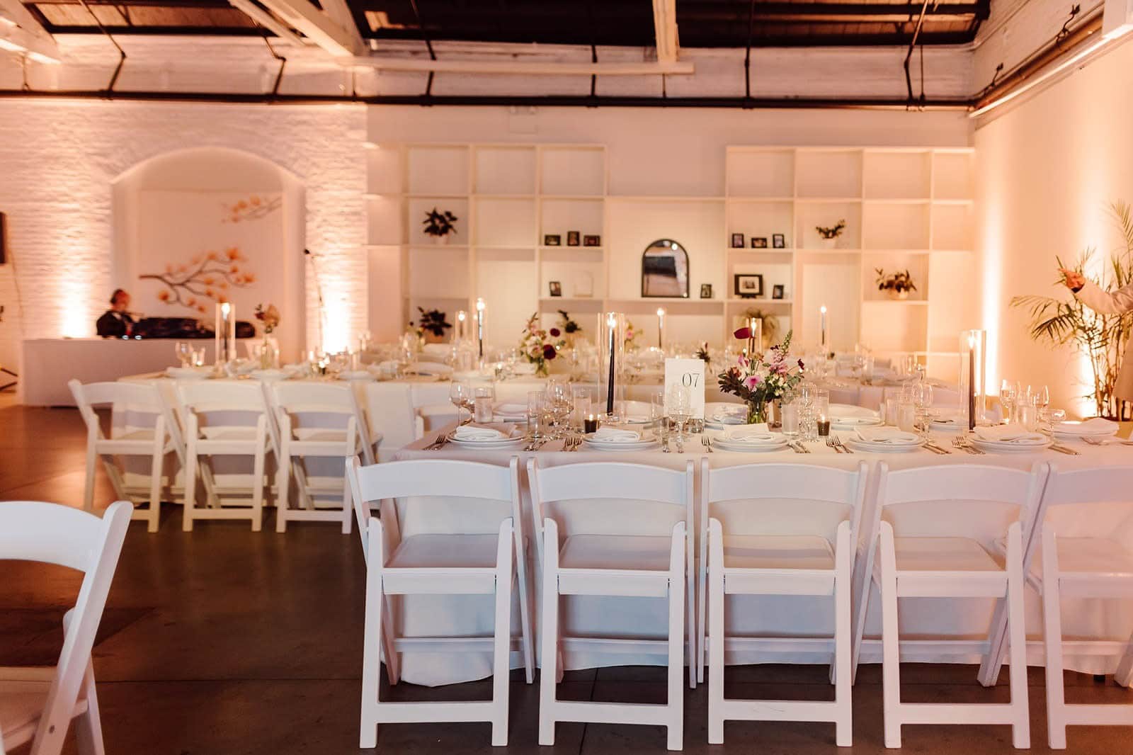 Candlelit wedding reception dinner table setting in historic Boston venue