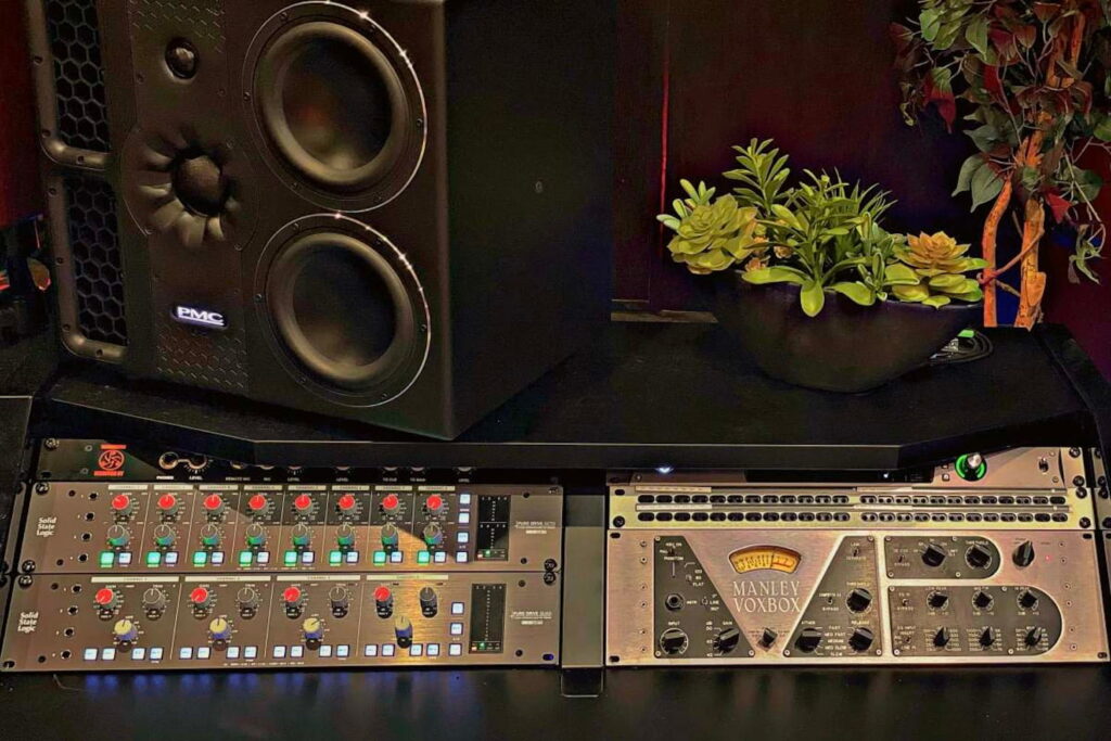 Close up shot of a mixing table at a recording studio