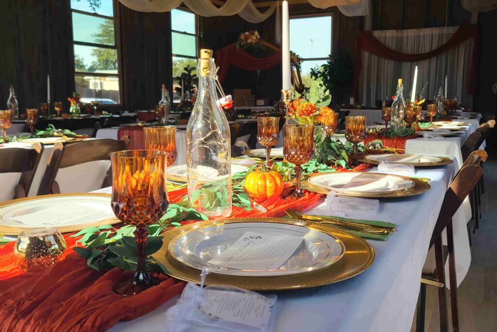 Autumn themed formal wedding tablescape with pumpkins and orange florals in Richmond