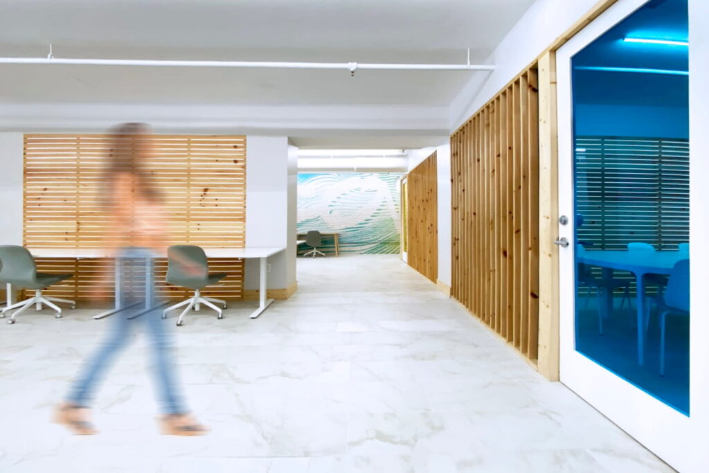 Wooden walls and murals provide a modern edge to an office space in Atlanta