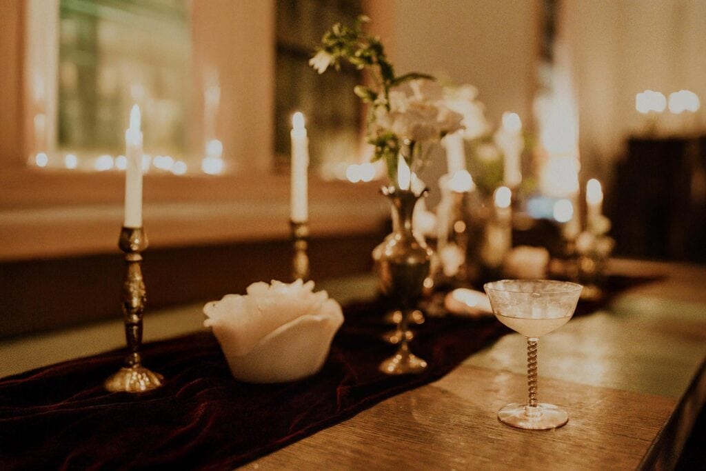 Elegant table setting with candlelight and cocktails for a Michigan wedding reception