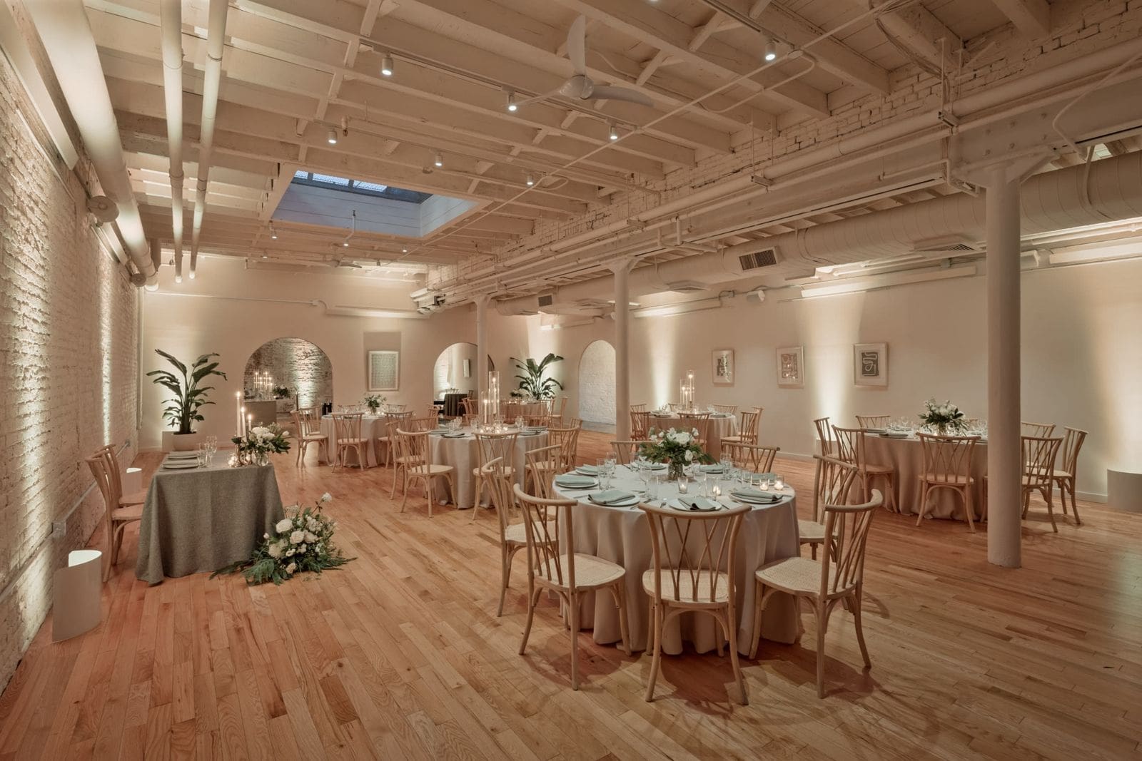 Elegant brick and beam reception venue setup by Boston wedding planners