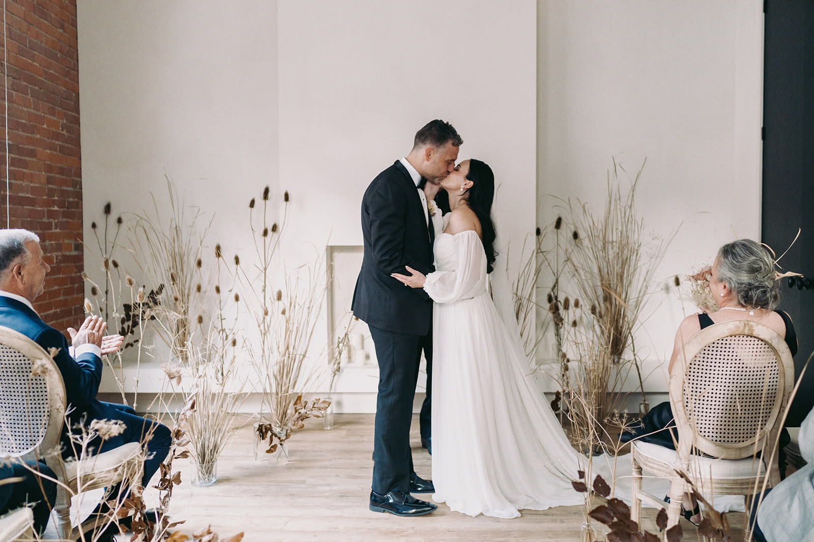 Bride and groom sharing intimate moment at modern Omaha wedding ceremony