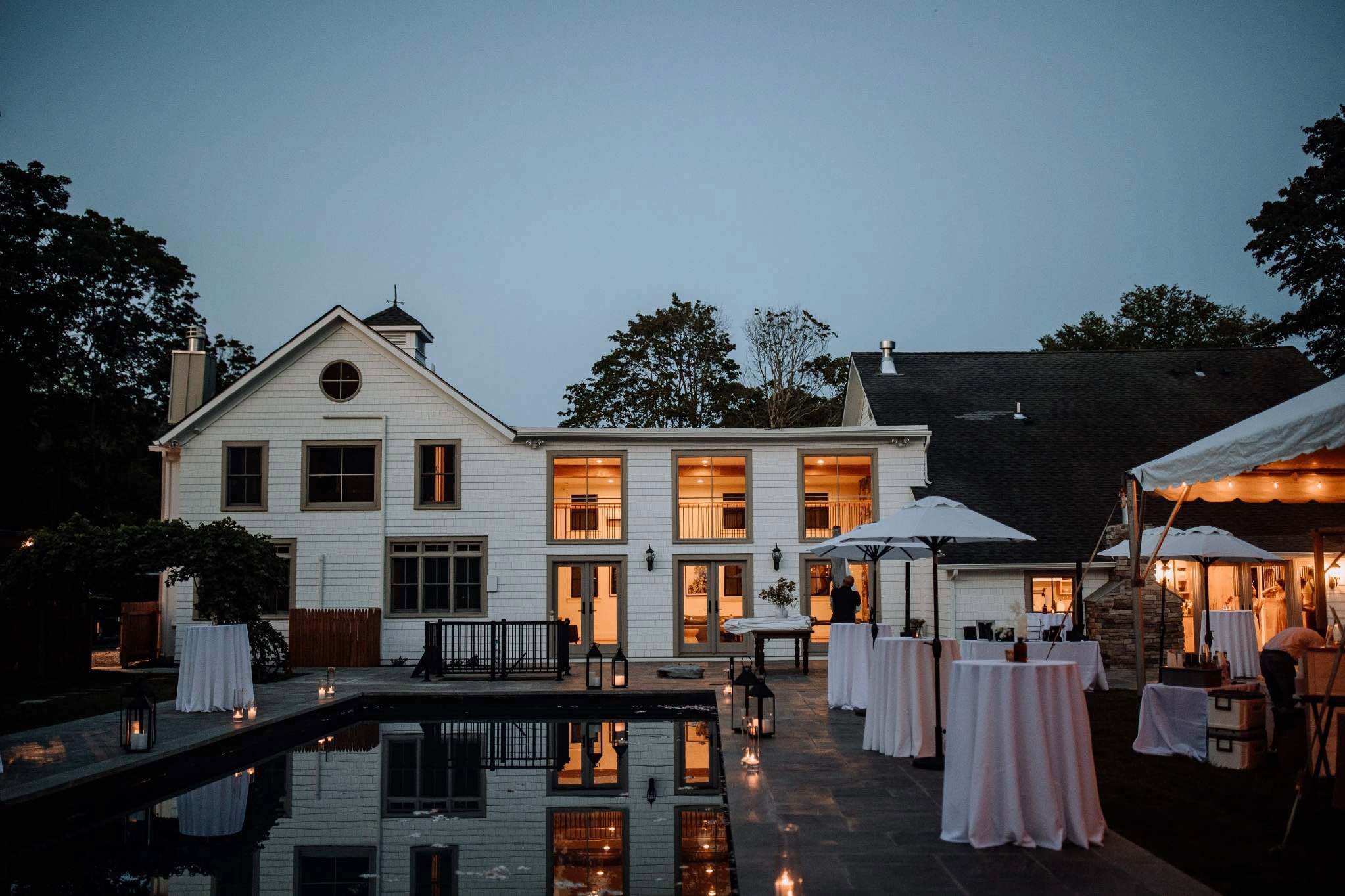 Outdoor Memphis wedding venue featuring estate house and pool reflection