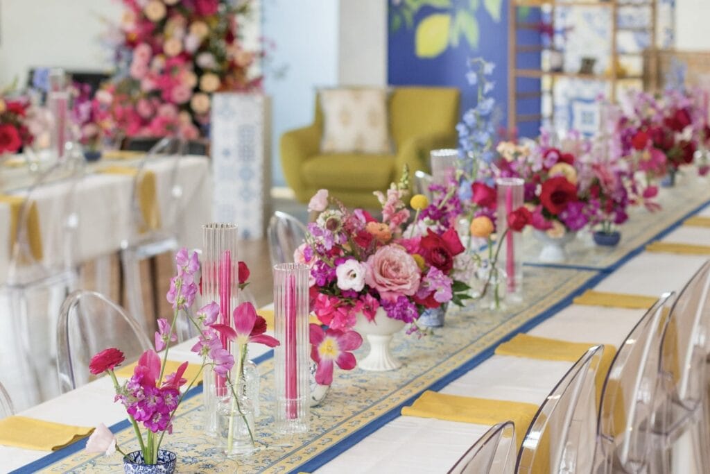 Colorful florals on long dining table set up by best Dallas party planners