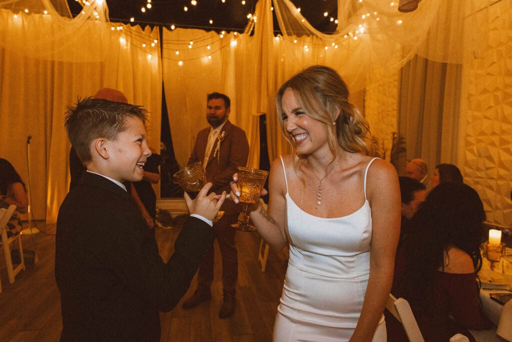 Guests toasting under string lights at a Maryland wedding reception
