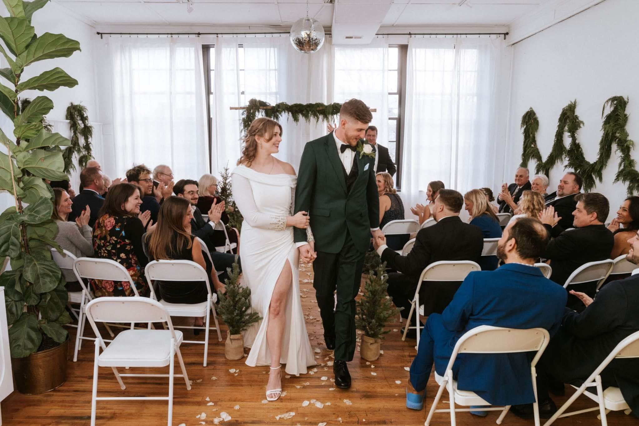 Bride and groom walking down aisle at modern Wisconsin wedding ceremony