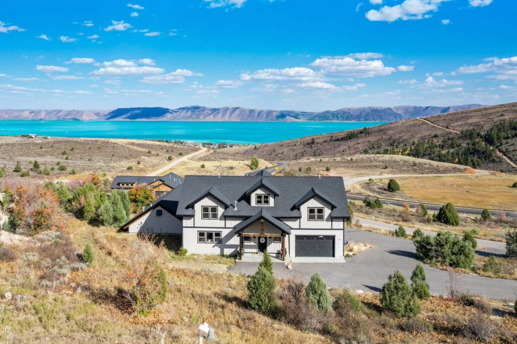 Lodge in the hills of Idaho with a lake in the distance and plains all around