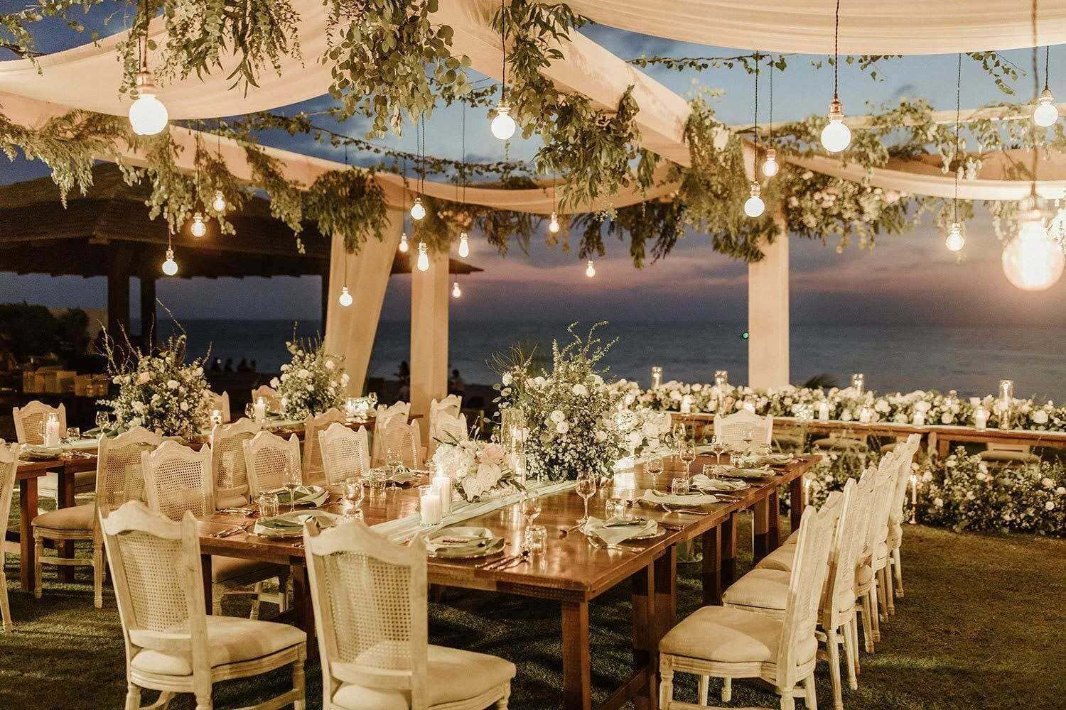 Elegant waterfront wedding reception with open-air Honolulu styling