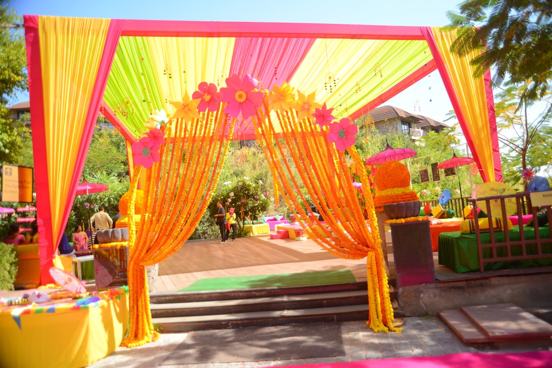 A beautifully decorated entrance for a celebration, featuring balloons, flowers, and welcoming signage.